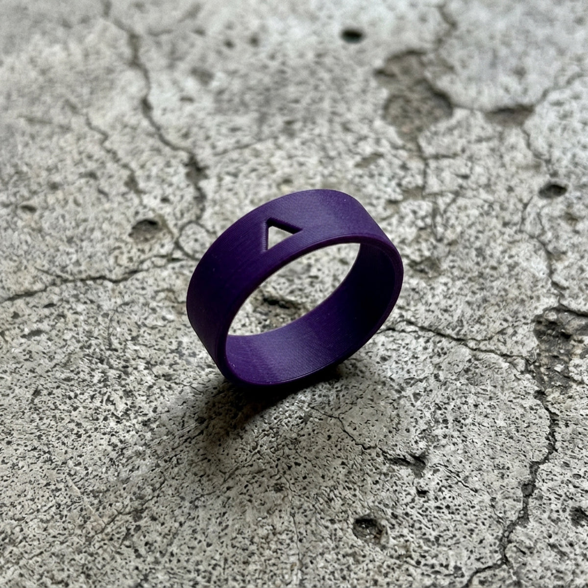 FK U** RINGS — Purple smooth ring on concrete side — ATTITUDE DESIGN